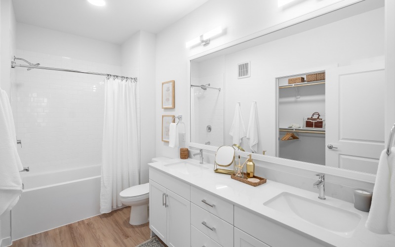 White bathroom with large shower tub combo